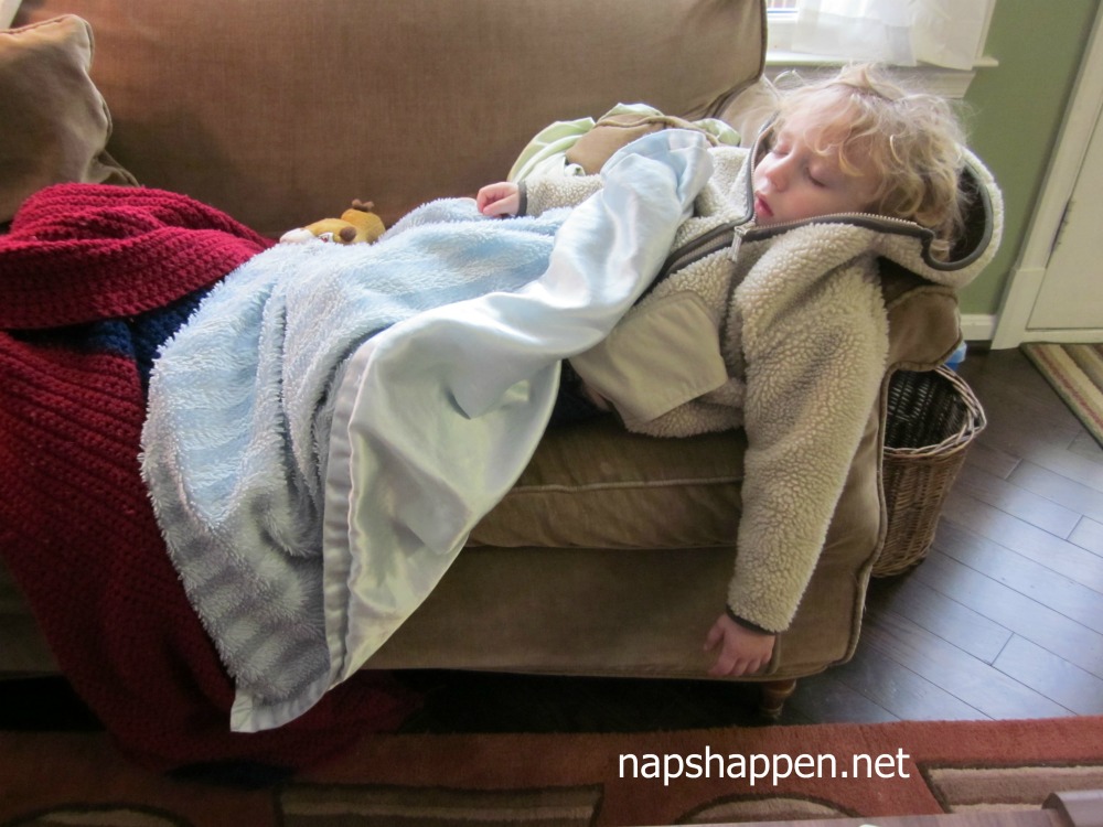 child napping on couch