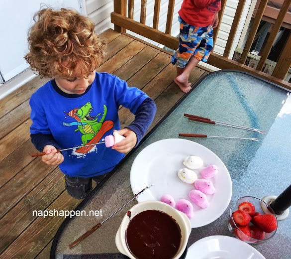 child spearing peeps on fondue fork