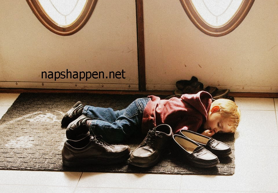 child asleep on shoes
