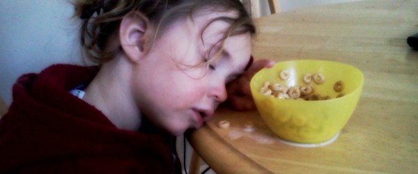 child asleep at table